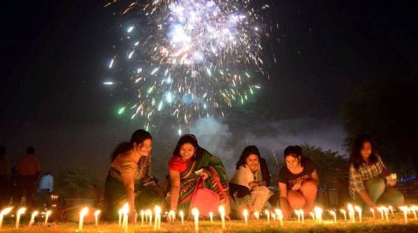 Allahabad: People light candles during track pujan at a stadium on the occasion of Dhanteras Festival Celebration in Allahabad on Friday. PTI Photo (PTI10_29_2016_000032B)